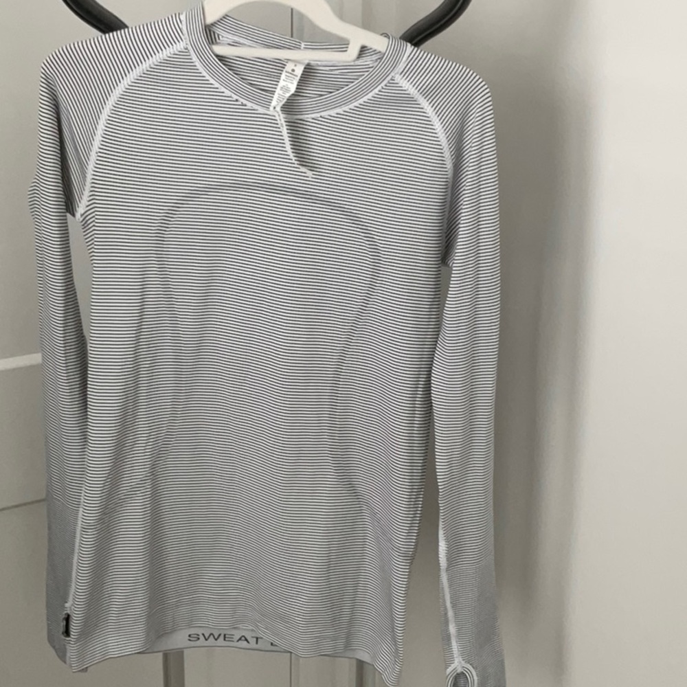 Lulu Lemon, woman’s size 8 long sleeve, smoke free home.  Like new!